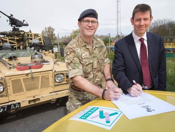 Signing the covenant is the Managing Director of Nexus Tobyn Hughes and Lt Col Andrew Black of the 4th Infantry Brigade.