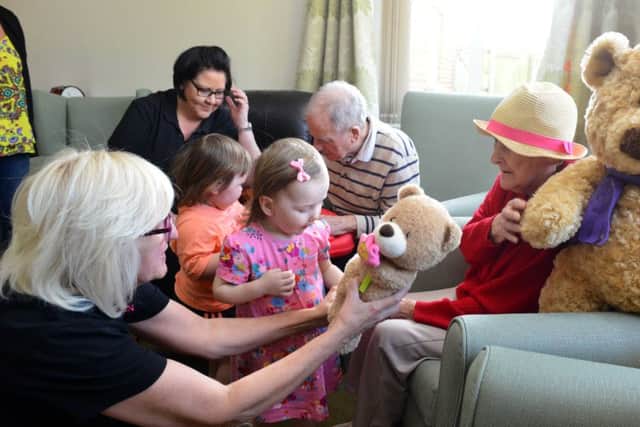 Youngsters new play group at Roseway House Care Home
Toddler Eva Robertson joins in with the residents.