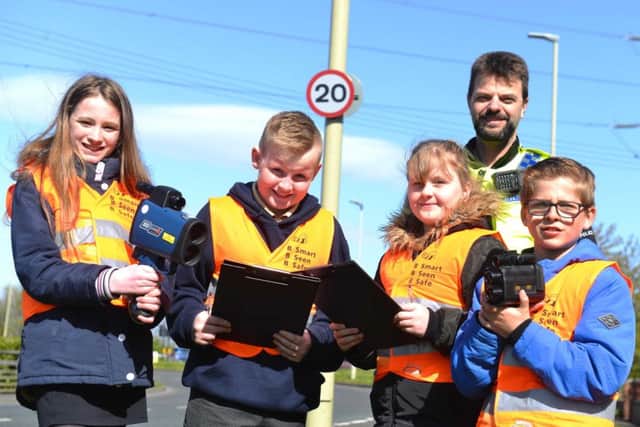 Members of the Hedworth Lane Primary School council are ready to catch speeding motorists with PC Luiz Scheidt.