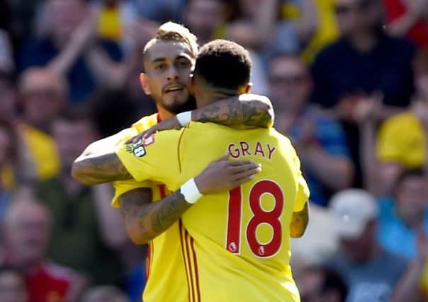 Watford's Andre Gray celebrates scoring his side's second goal of the game with team mate Roberto Pereyra.
