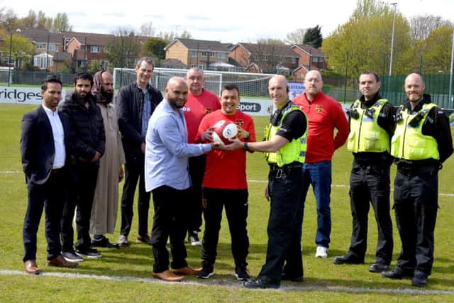 Front from left to right, Abdul Ahad, Shaun Clark and PC Chris Howey with some of the others who are set to take part in the charity game.