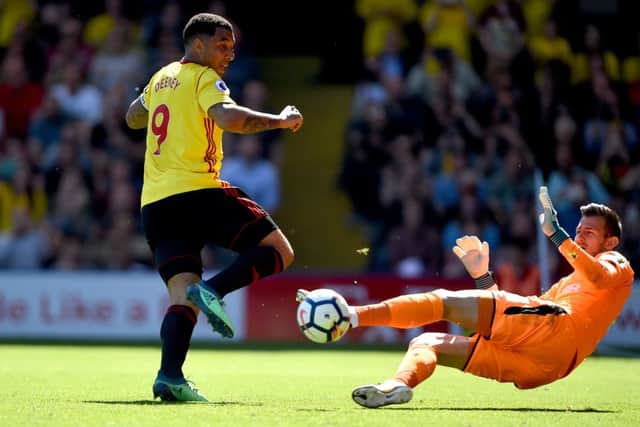 Martin Dubravka denies Troy Deeney from the penalty rebound.