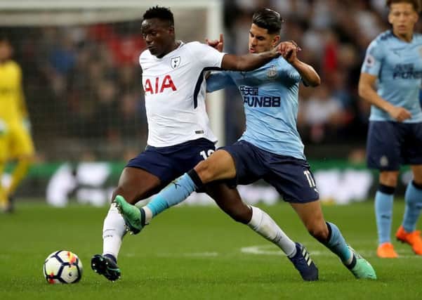 Newcastle forward Ayoze Perez  battles against Tottenhams Victor Wanyama at Wembley tonight.