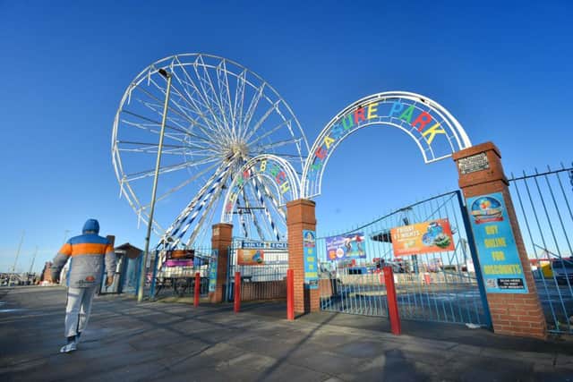 The rollercoaster has replaced a ferris wheel at the pleasure park.
