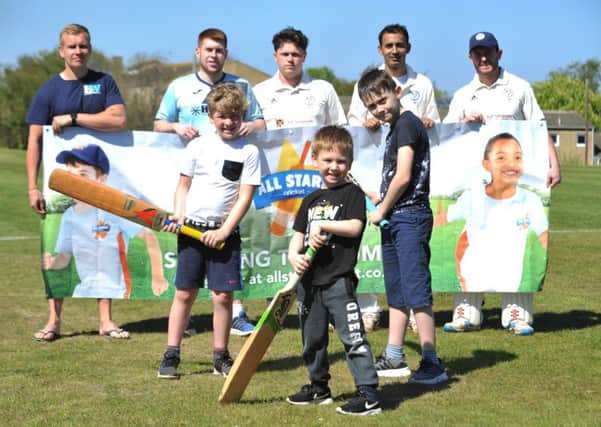 Cricket youngsters, left to right, Zac and Noa Drysdale, and Lucas Roberts with members of Whiteleas Cricket Club