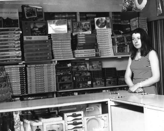 Lynn Edwards with some of the wide display of toys in Harlow Products.