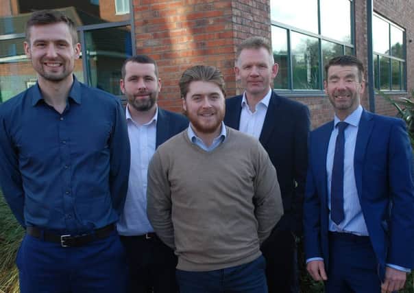 James Staines (left) and Fin Gregory (front centre) with Waymark directors Jason Hylton-Jones (second left), David Brophy (second right) and Paul Lofthouse (right)