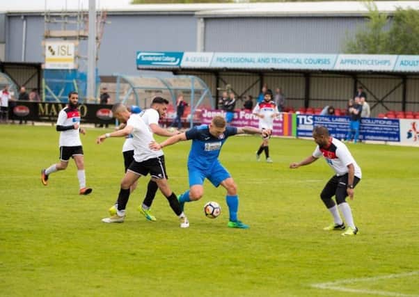 Martyn Waghorn, centre, in action.