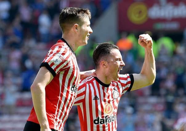 Paddy McNair (left) enjoys his goal against Wolves with Bryan Oviedo. Picture by Frank Reid