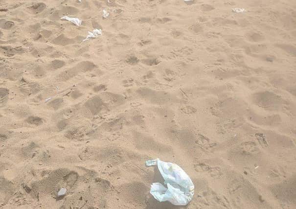 Nappies left discarded on the beach