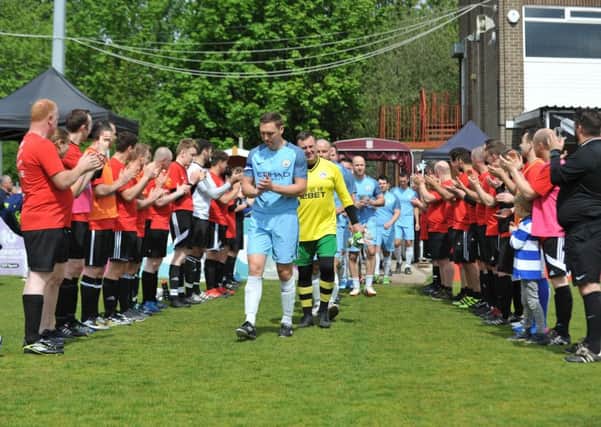 The Hilton Gateshead squad formed a guard of honour for the emergency services side as players entered the pitch.