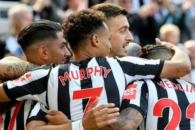 Newcastle's players celebrate with goalscorer Ayoze Perez