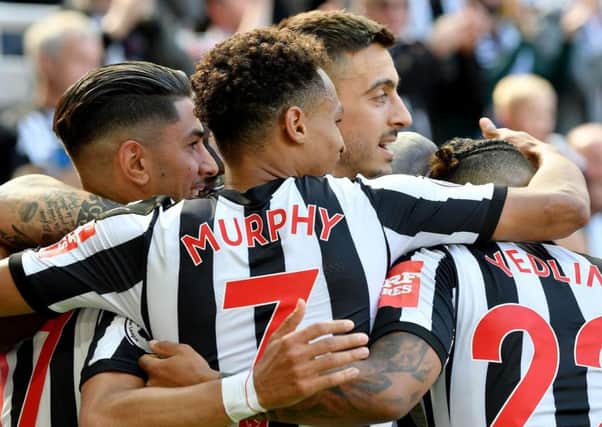 Newcastle's players celebrate with goalscorer Ayoze Perez