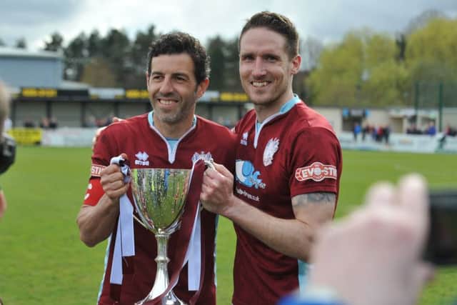 Julio Arca and Jon Shaw hold the Evo-Stik North championship trophy. Picture by Tim Richardson