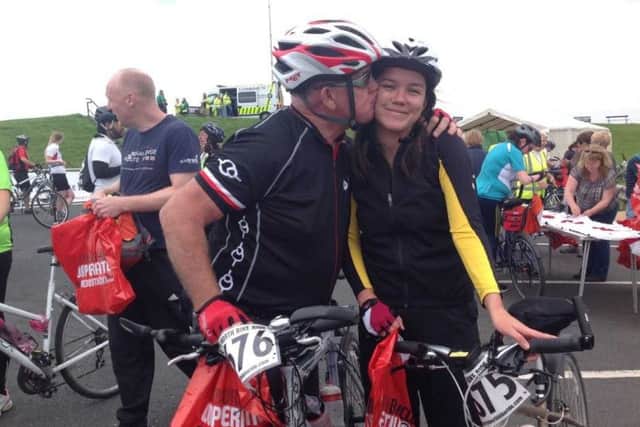 David Sinclair and daughter Samatha after they crossed over the finishing line of the Great North Bike Ride.