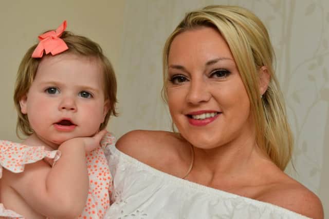 Presley Marshall, 2 with mother Sophie Findlay following treatment for retinoblastoma.
