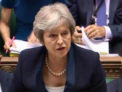 PM Theresa May speaking during Prime Minister's Questions. Image by Parliament Live TV.