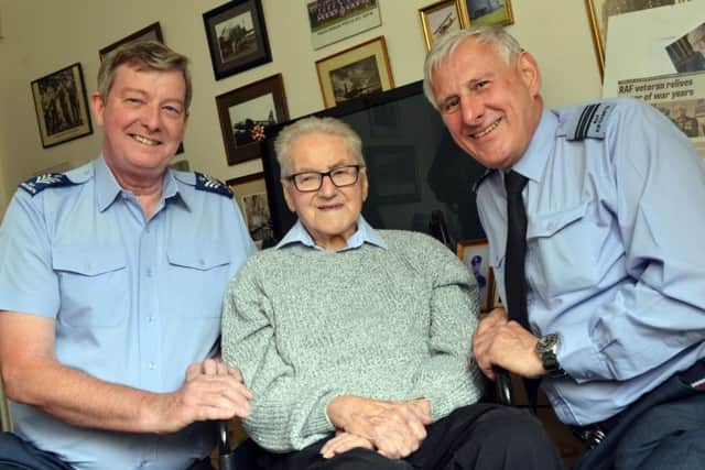 Former RAF World War two veteran Harold Yeoman has a visist from serving RAF officers. Officers from left Flt.Sgt John Collins and Flt.Lt Nigel Yarrow