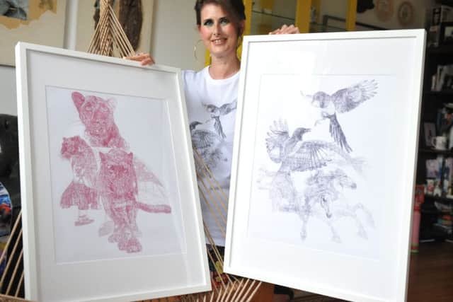 Artist Jane Lee McCracken with her Newcastle and Sunderland inspired T-shirt designs.